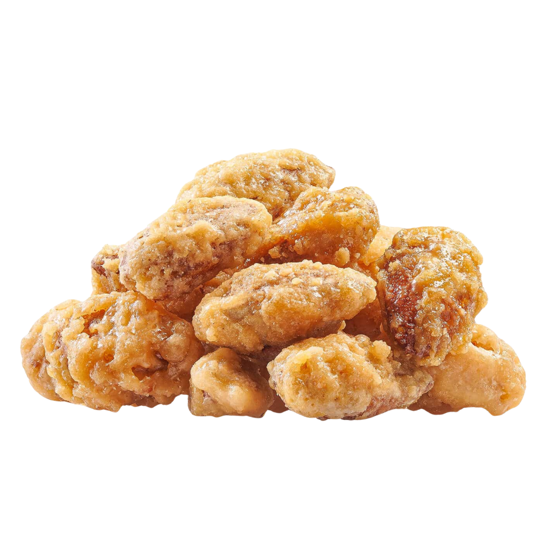 Cluster of roasted almonds on a white background