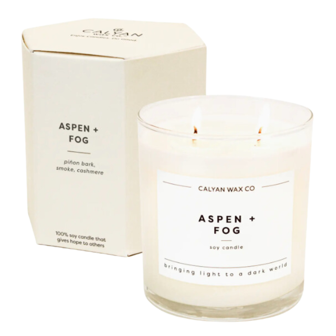 12.5-ounce soy wax candle named 'Aspen and Fog,' with a label that evokes the fresh, crisp scent of aspen trees and misty fog, designed to create a relaxing ambiance.