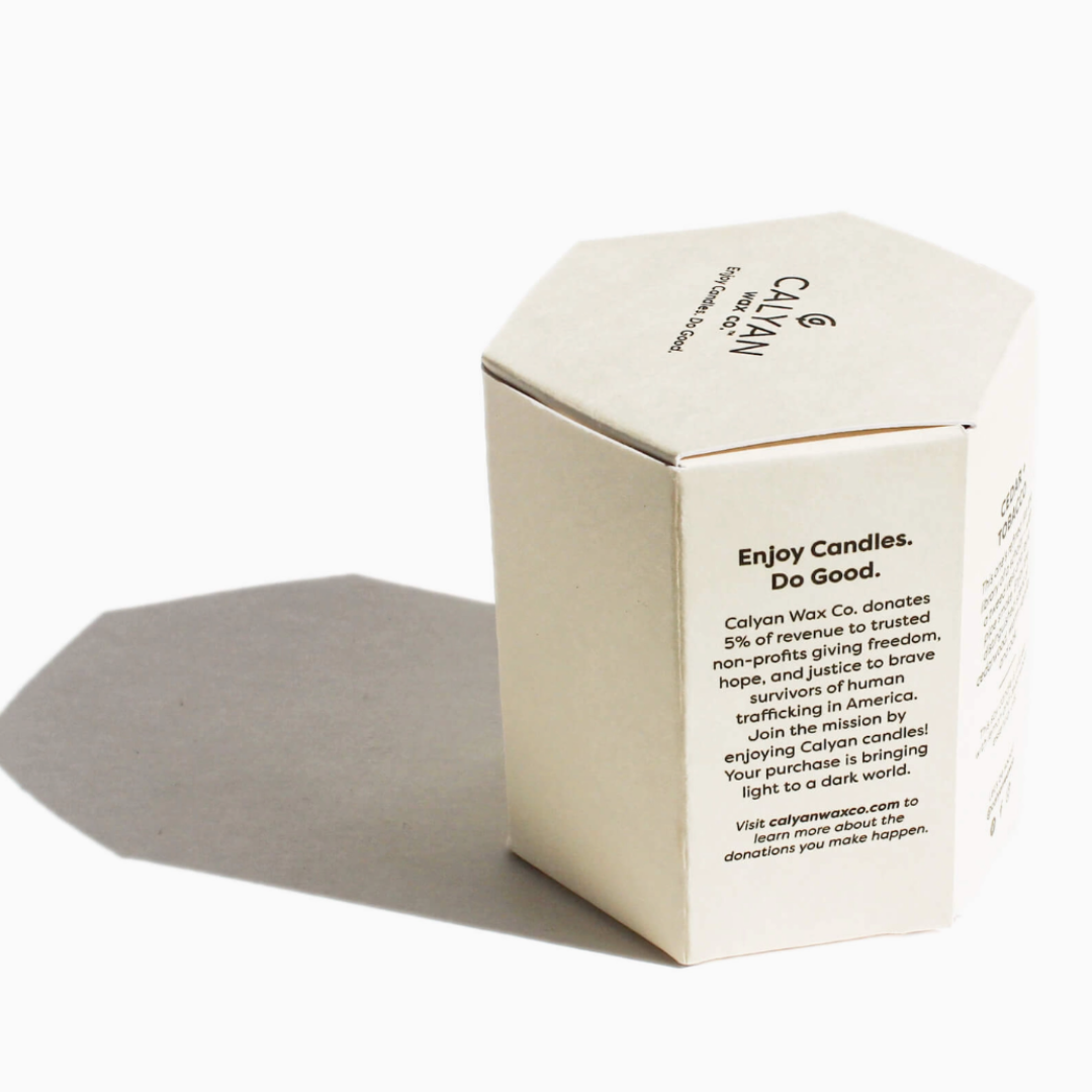 12.5-ounce soy wax candle named 'Aspen and Fog,' with a label that evokes the fresh, crisp scent of aspen trees and misty fog, designed to create a relaxing ambiance.