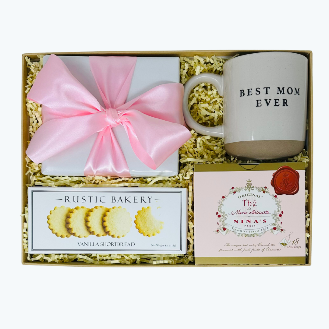Gift set with mug, cookies, and tea in a box.