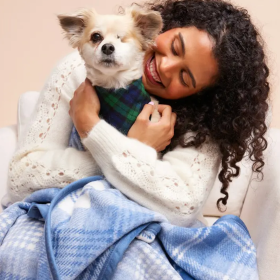 A stylish, heirloom-quality blanket, featuring elegant winter patterns and soft yarn colors, designed to become a favorite for both pets and their owners.