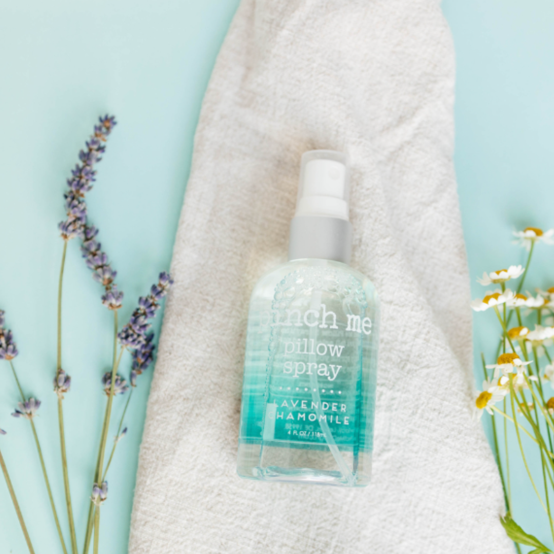 Bottle of Pinch Me Pillow Spray with a soothing lavender chamomile fragrance, designed to help create a peaceful and restful sleep environment.