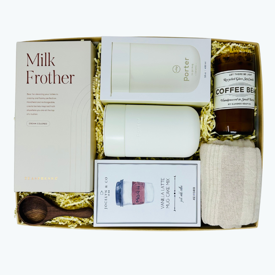 Gift set with milk frother, coffee candle, W&P reusable mug and other items in a box.