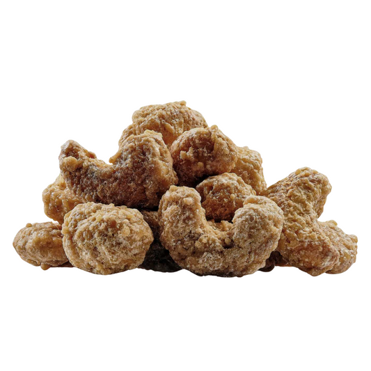 Pile of brown sugared almonds on a white background.