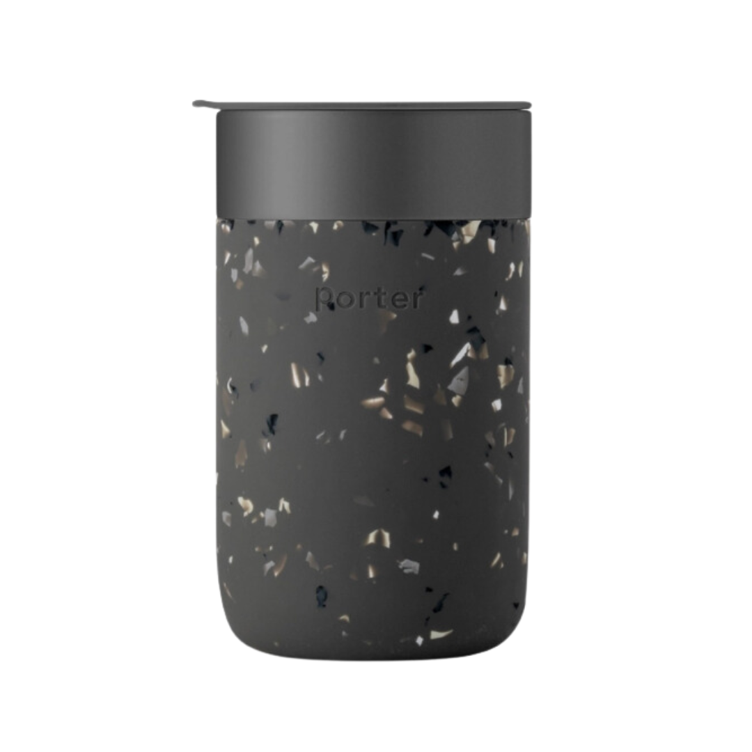 Sleek charcoal-colored 16 oz Porter Insulated Tumbler with a matte silicone sleeve, ceramic interior, and splash-proof lid, ideal for hot or cold beverages.