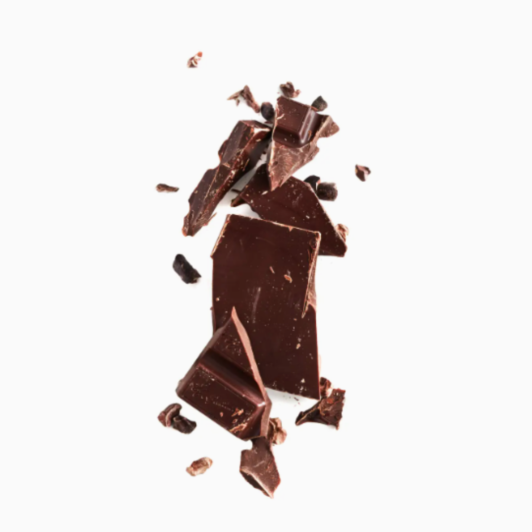 A chocolate bar broken into several pieces, revealing its smooth, glossy texture. The chocolate pieces are irregular in shape, with a rich, dark color and a few small cracks, showing the interior of the bar.