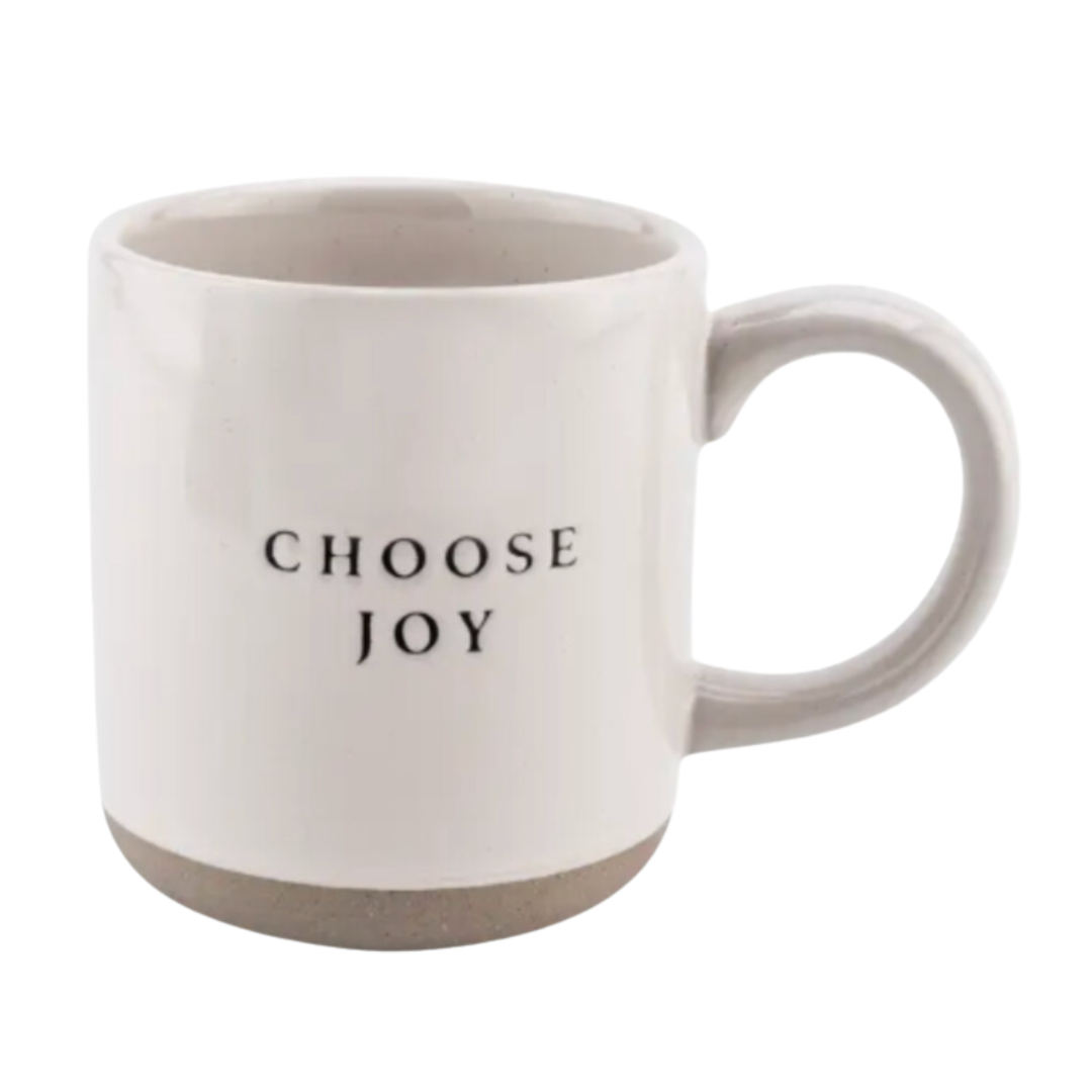 A stoneware mug with the message "Choose Joy" in elegant script, featuring a matte finish and a warm, neutral color that complements its uplifting and inspirational design.