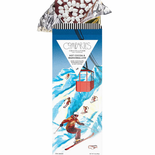 A beautifully packaged box of award-winning gourmet dark chocolate covered in fluffy holiday marshmallows, perfect for winter gifting. The ski chic design adds a festive touch to this delicious, gluten-free treat.