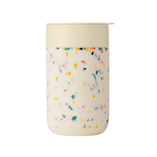 Cream-colored 16 oz Porter Insulated Tumbler with a matte silicone sleeve, ceramic interior, and splash-proof lid for pure, temperature-controlled hydration.