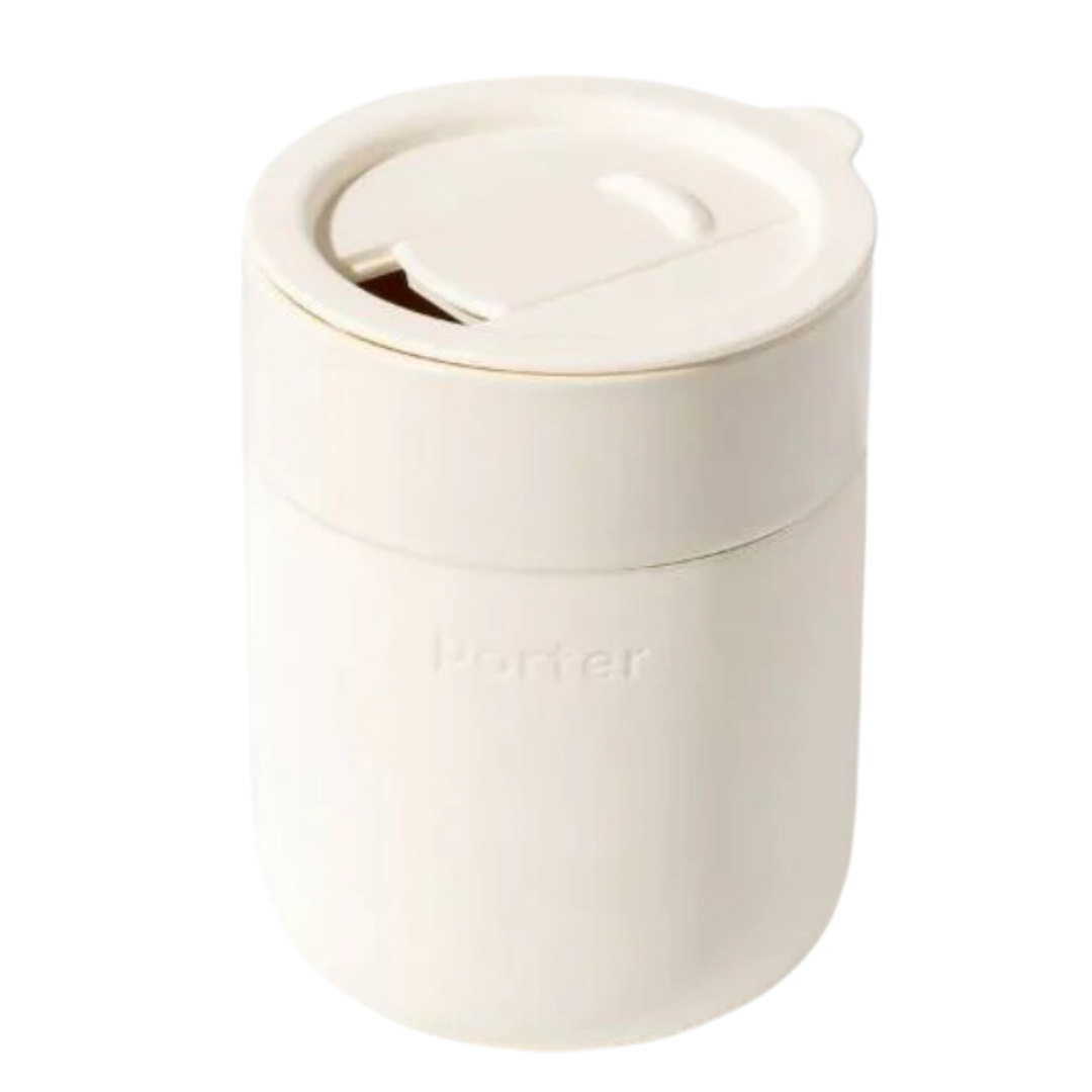 Cream ceramic mug with 12oz capacity, wrapped in silicone sleeve and featuring a sliding lid.