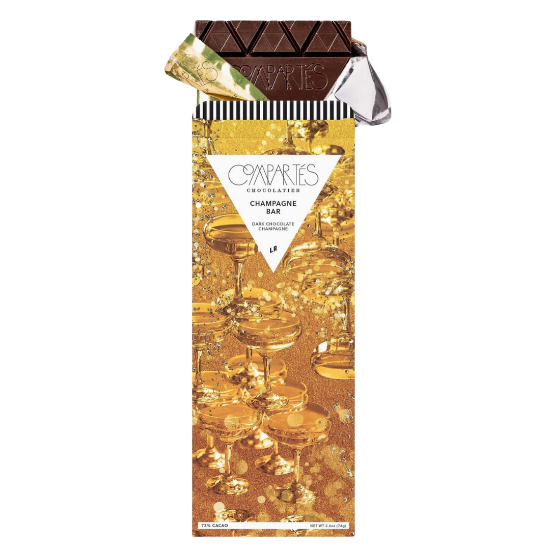 Indulge in the Compartés Champagne Dark Chocolate Bar, a gourmet treat that blends premium dark chocolate with Moet Champagne. Handcrafted in the USA and beautifully wrapped in gold, this bar offers a truly luxurious and delicious experience.