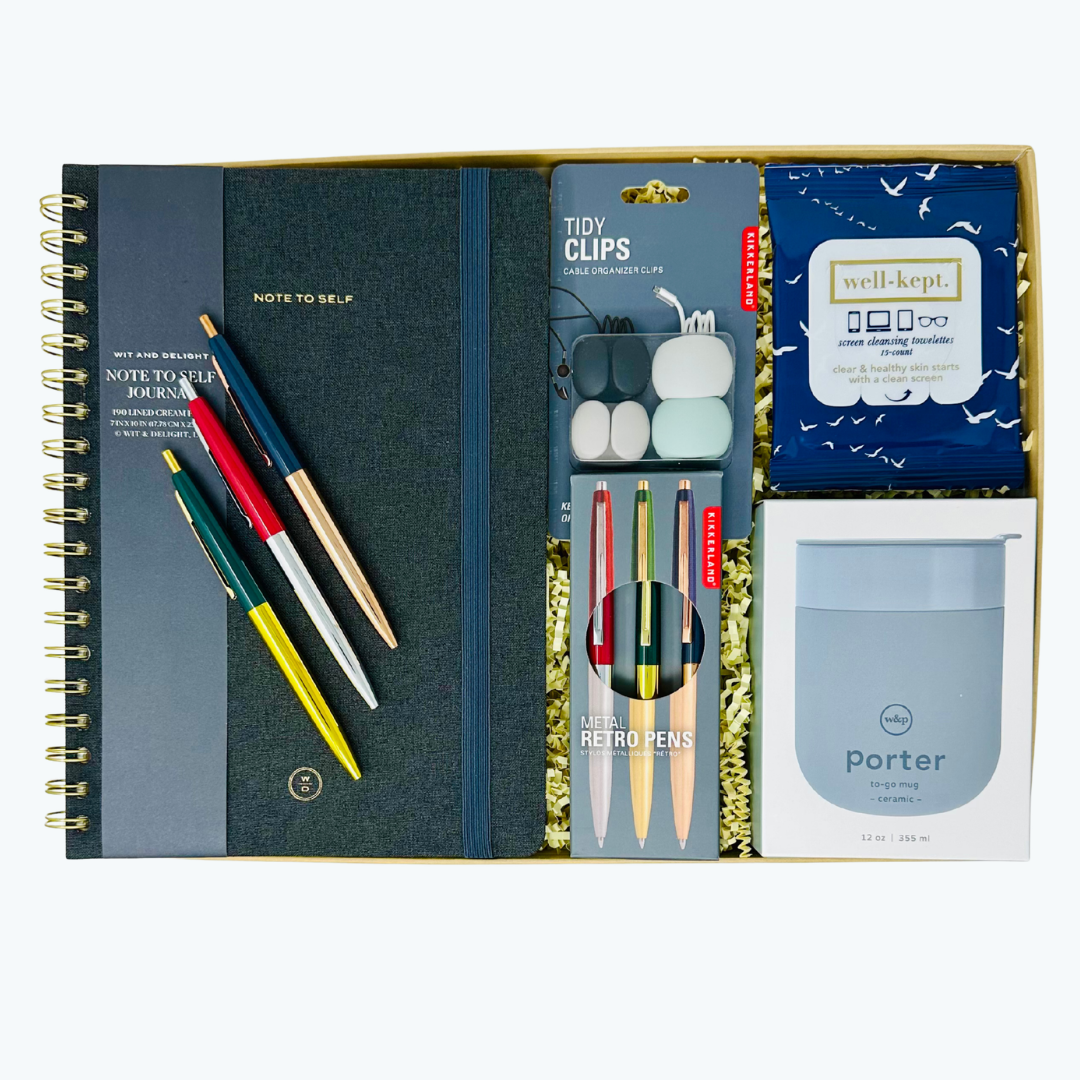 Linen journal, pen set, W&P tumbler, and cord clips in a box on a white background.