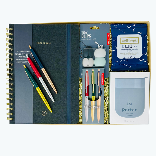 Linen journal, pen set, W&P tumbler, and cord clips in a box on a white background.