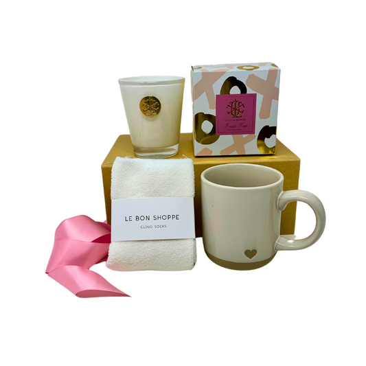 Beautifully curated Thinking of You gift box with cozy cloud socks, a heartwarming Hugs & Kisses candle, and an elegant stoneware heart mug, all wrapped with care to express your love and thoughtfulness.