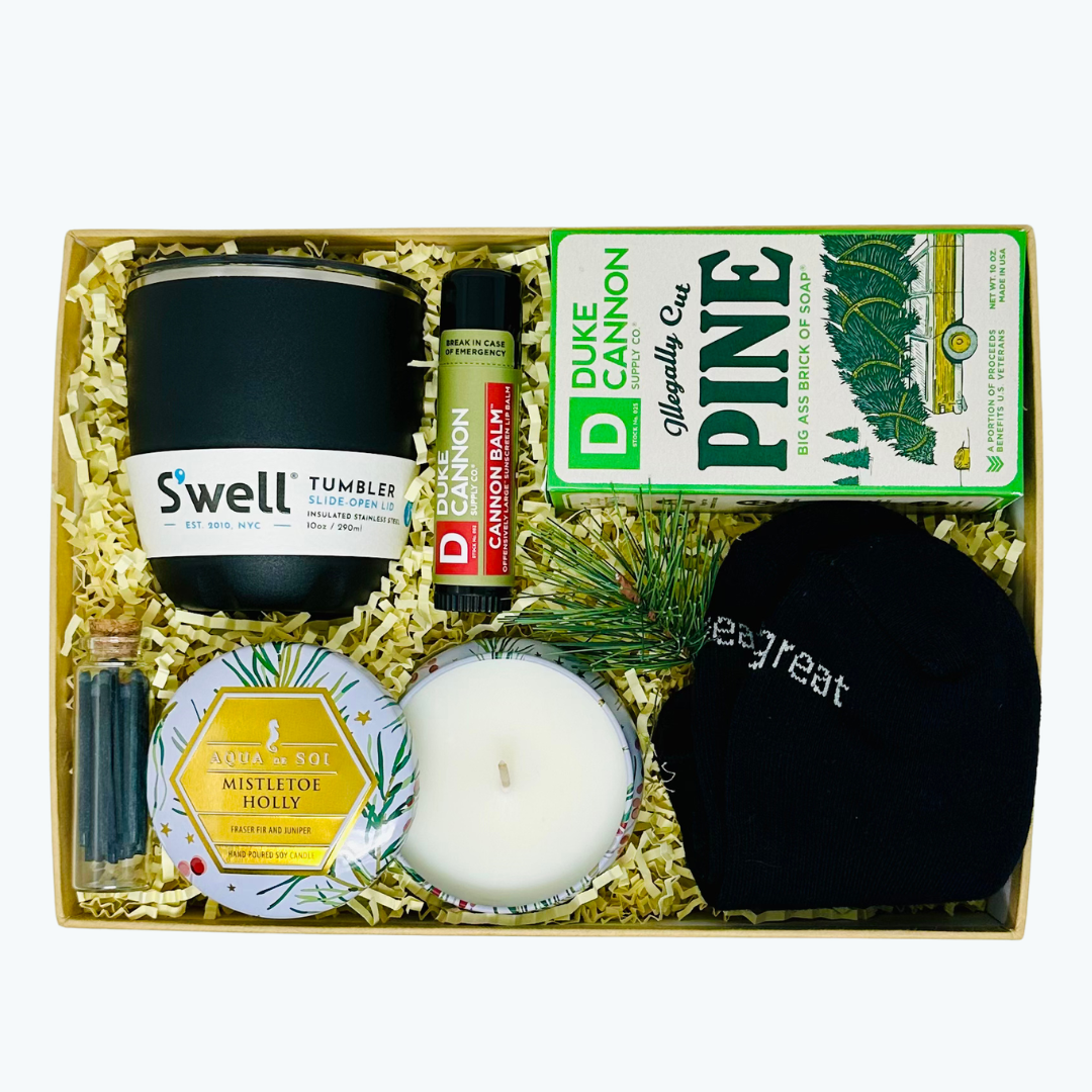Gift set with Swell tumbler, Duke Cannon products, socks, matches, candle and other items in a box.
