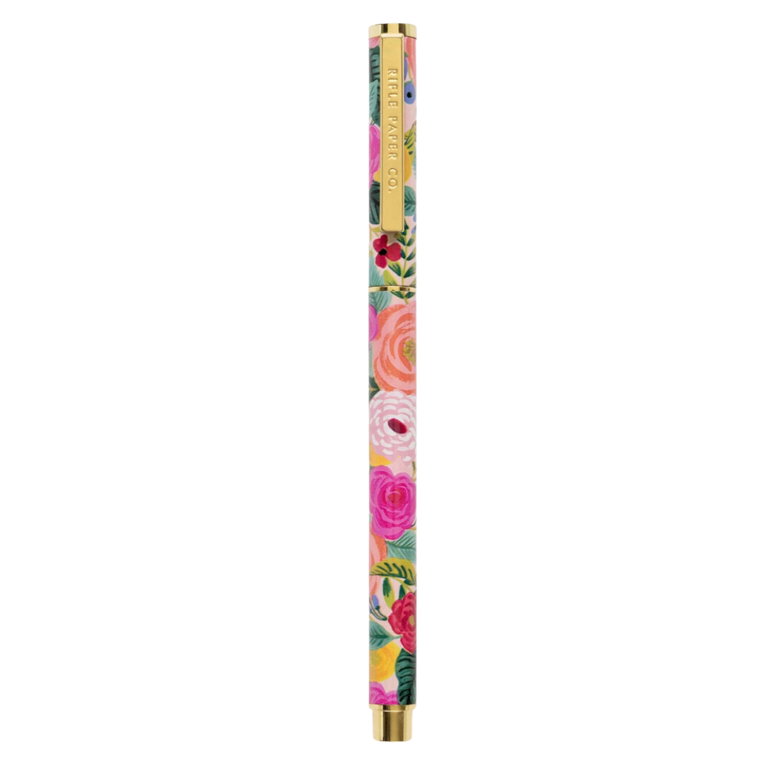 A stylish Garden Party Pen by Rifle Paper Co. featuring a stainless steel body with brass accents. The pen is designed with a 0.5 mm rollerball tip and is adorned with Rifle Paper Co.'s signature colorful floral pattern. It is displayed horizontally against a clean, neutral background.