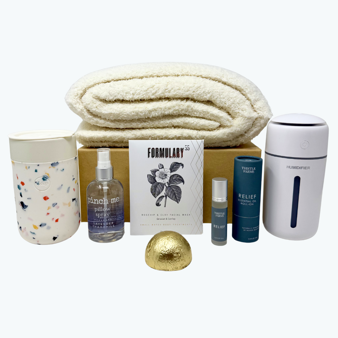 Collection of items including a towel, cups, bottles, and a shower steamer on a white background.