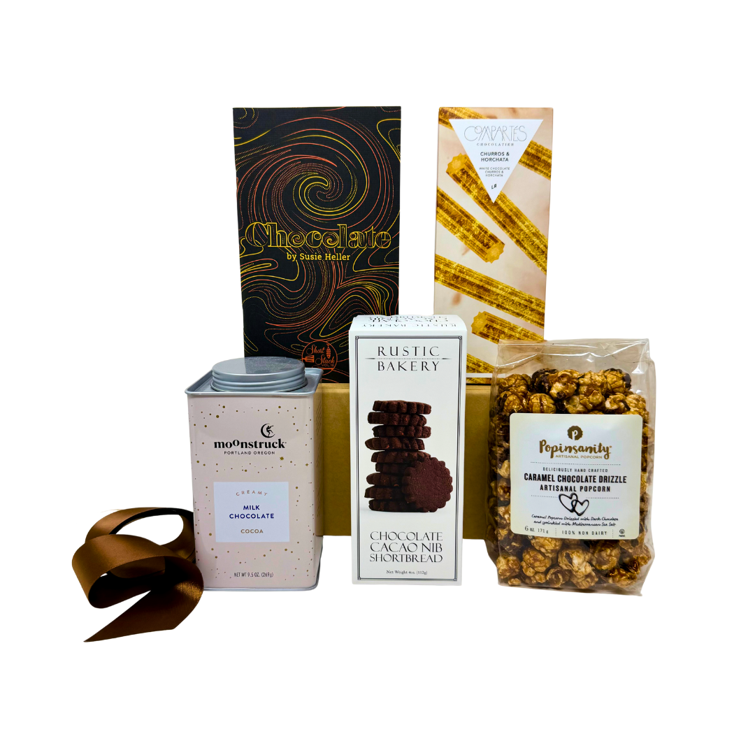 gift box with chocolate cookies, popcorn, chocolate bar and more on a white background.