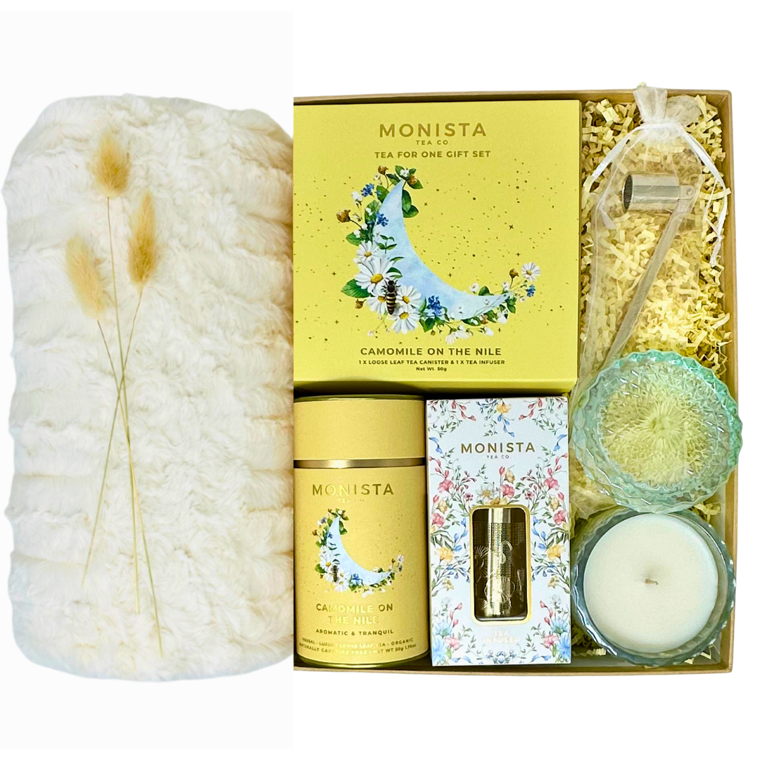 Monista tea gift set with candles and packaging on a white background