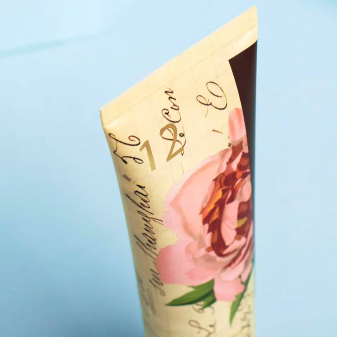 A luxurious bottle of Gin & Rosewater Shower Gel, emphasizing its alluring scent profile of citrus zest, rosewood, mimosa, and mandarin. Ideal for transforming your bathing routine into a fragrant escape.