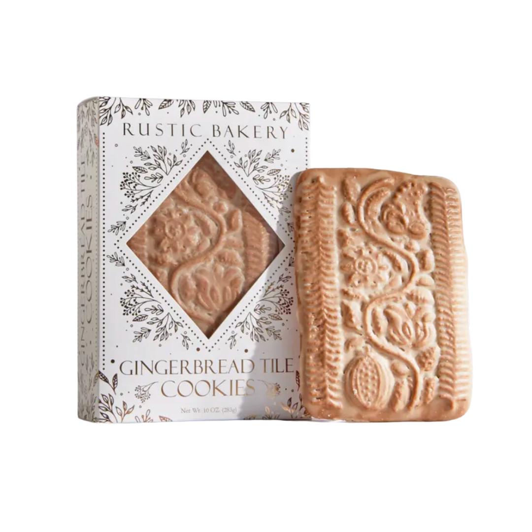 A beautiful box of hand-rolled holiday tiles, featuring spiced delicacies topped with a delicate vanilla glaze, showcasing intricate engravings, perfect for festive celebrations and gift-giving.