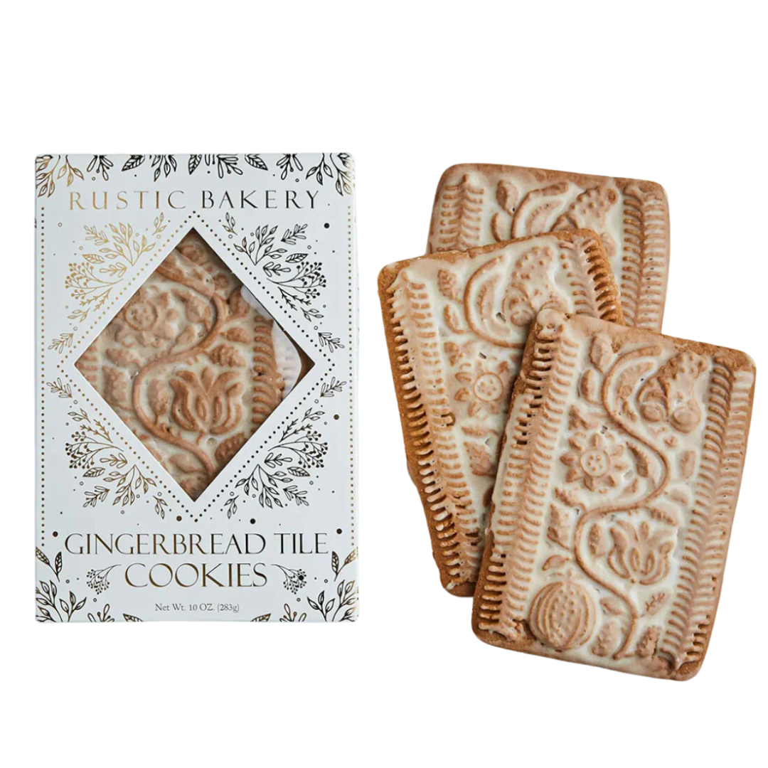 A beautifully arranged stack of hand-rolled holiday tile cookies, featuring spiced delicacies with a delicate vanilla glaze. Each tile is intricately engraved and artistically presented, showcasing their festive appeal, perfect for holiday gatherings or as a luxurious gift.