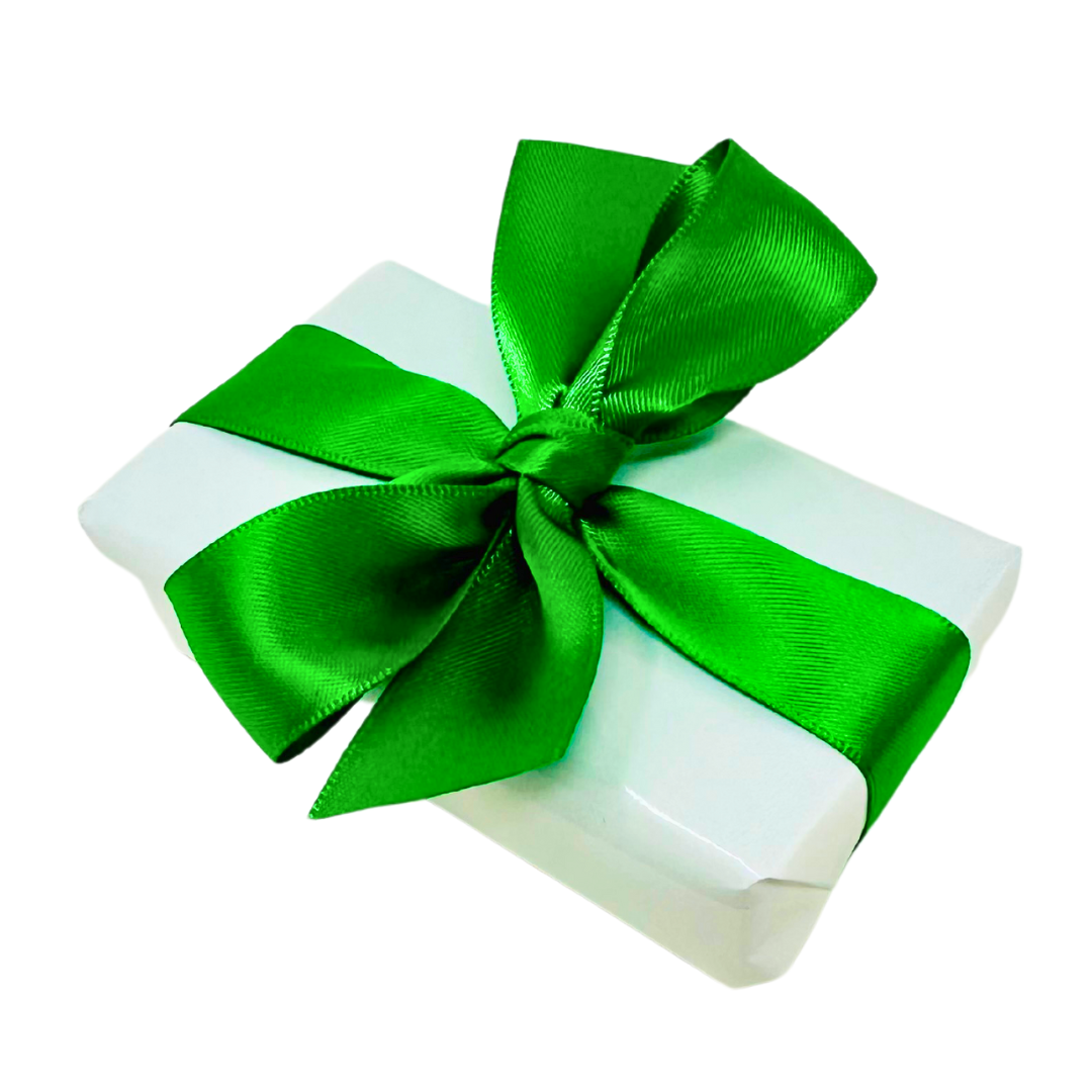 A white rectangle box wrapped in white paper and a bright green satin ribbon. Inside the box but not shown are golf ball markers for the curated golf gift box from Me To You Box.