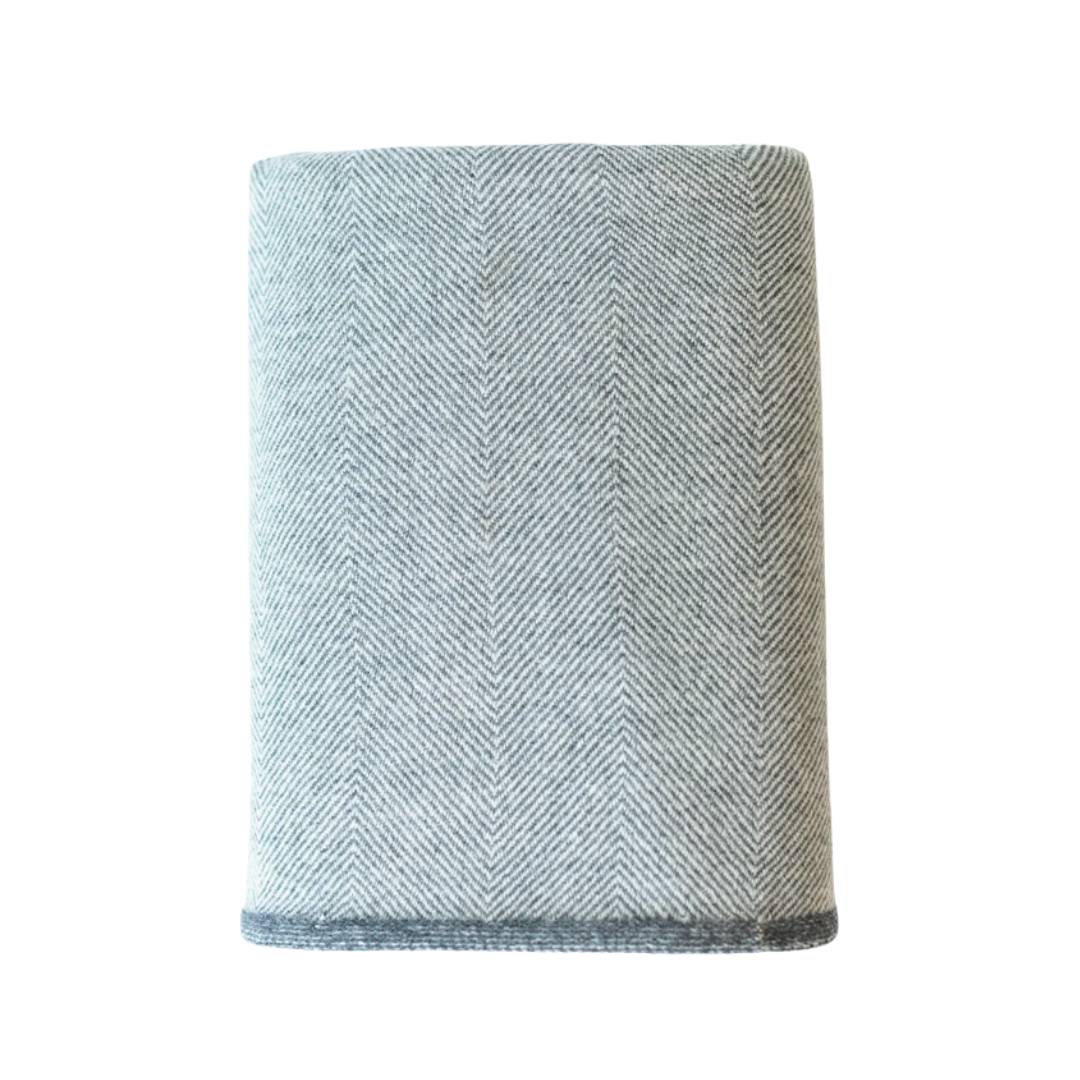 Textured cashmere with a herringbone pattern on a white background.