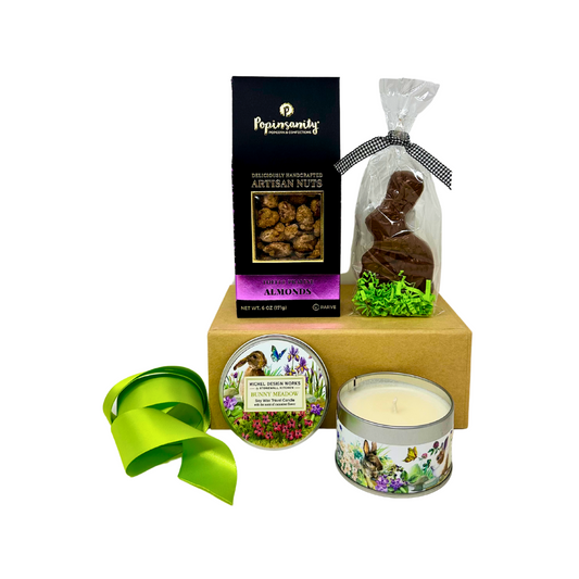 A beautifully curated Easter gift box filled with festive treats, including a gourmet solid milk chocolate bunny, Bunny Meadow soy wax tin candle, and delicious toffee praline roasted almonds. This thoughtfully designed box is perfect for Easter celebrations or spring birthdays, offering sweet surprises and seasonal charm. Every purchase supports Julia's Butterfly Foundation and the Nephrotic Syndrome Foundation’s Little Angels Care Package Program. Eco-friendly and elegant gift box.