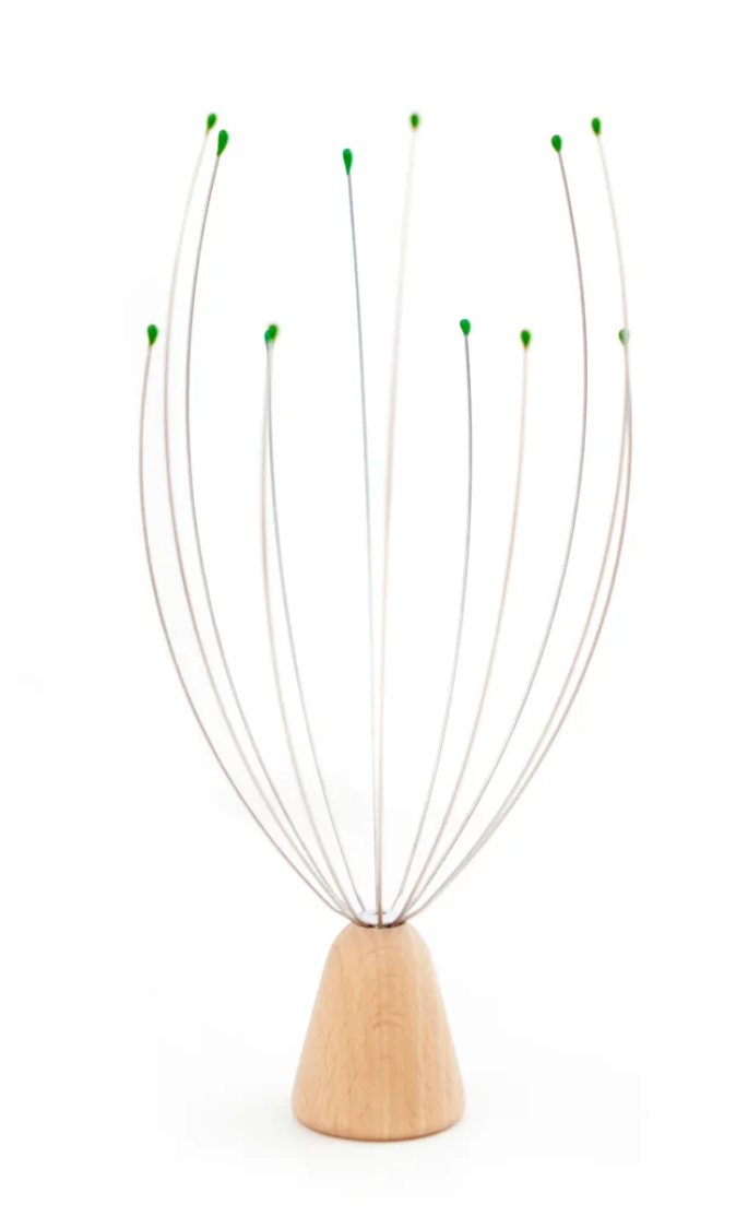 A wooden base head massager with multiple thin metal wire arms extending upward to green-tipped points, set against a plain white background.