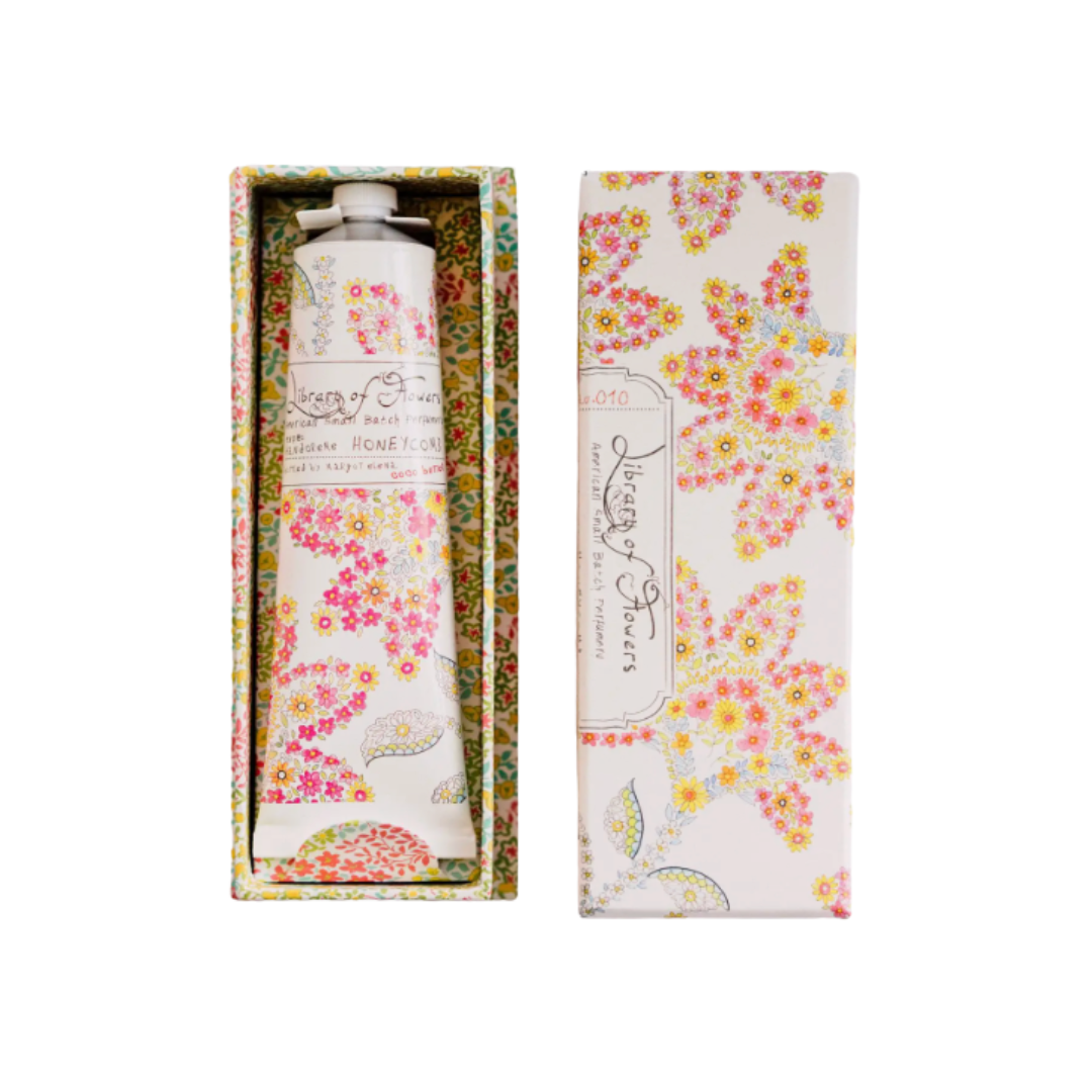 Hand cream in floral packaging with matching box on a white background