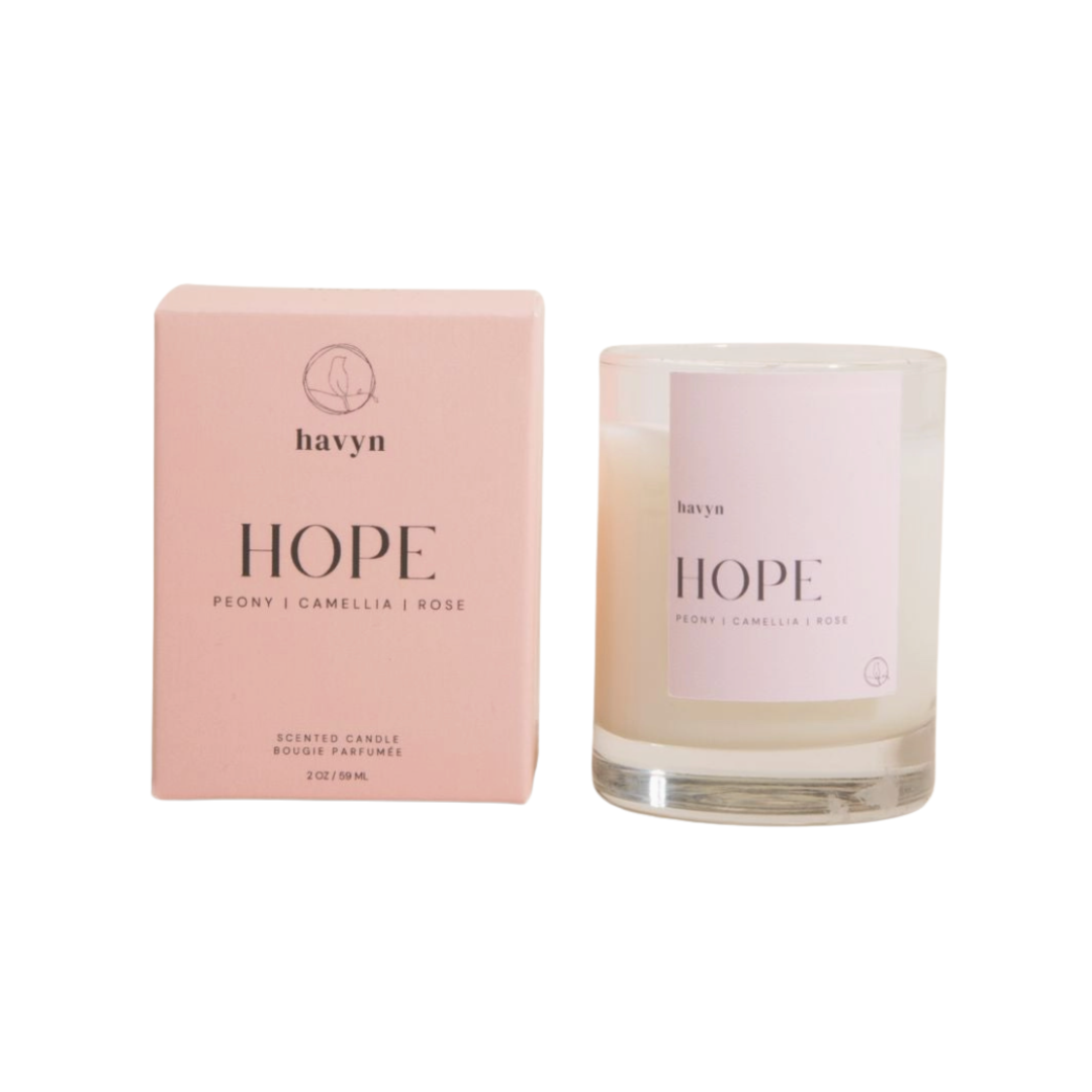 Havyn 'Hope' scented clear glass candle and light pink packaging on a white background.