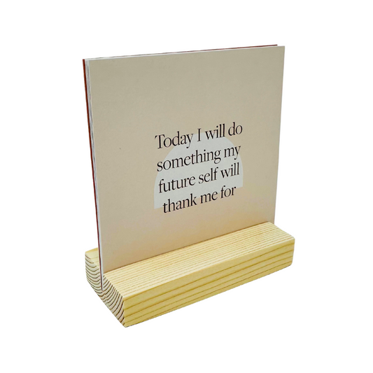 A wooden stand holding vibrant affirmation cards, radiating positivity and encouragement.