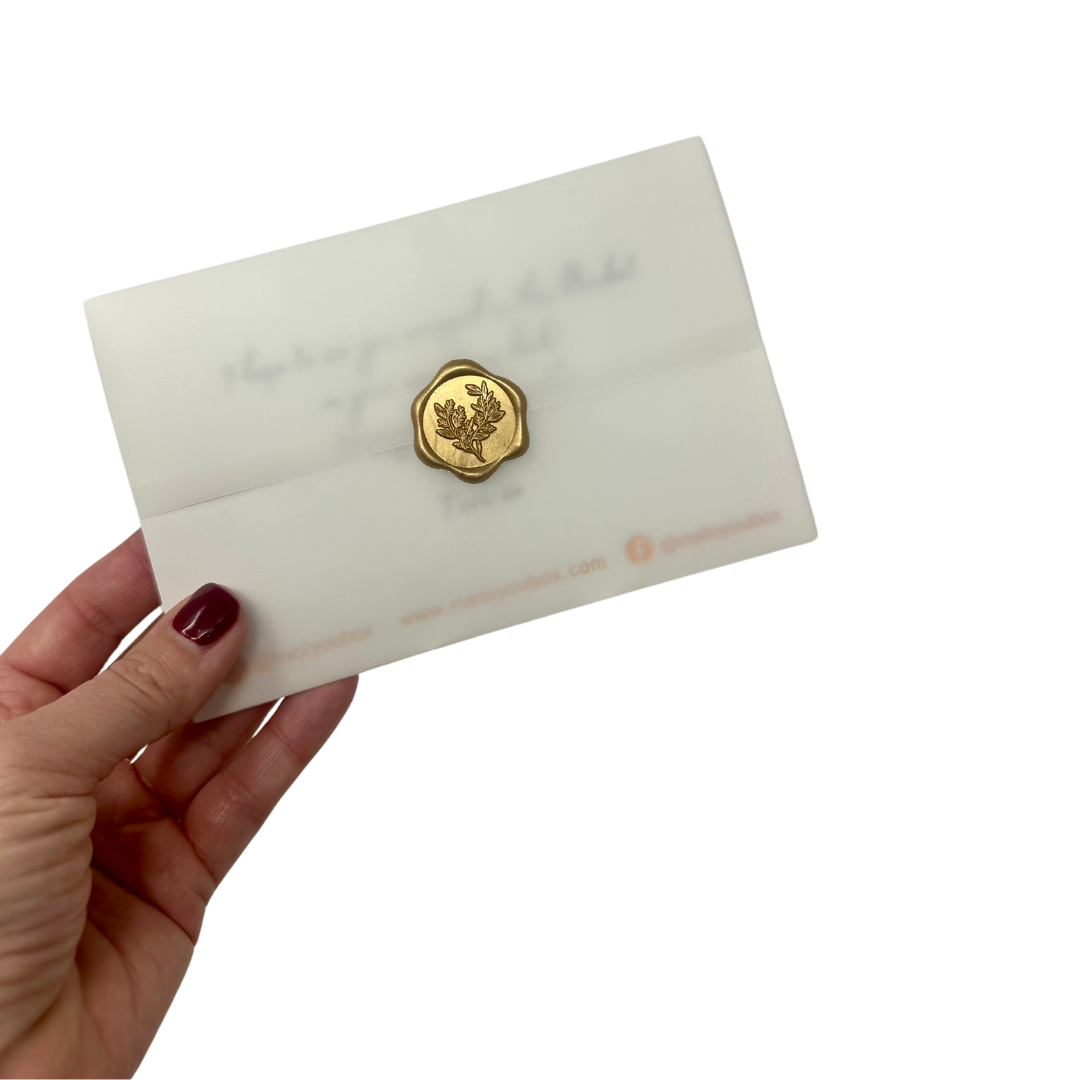 A 4x6 inch card inside a vellum wrap and sealed with a gold wax seal. Part of Me To You Box's gift curation used to print your gift message on and placed inside the gift.