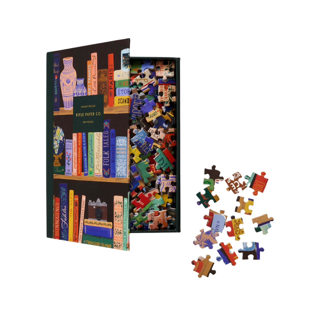 Rifle Paper Co. Bookshelf Jigsaw Puzzle featuring classic titles and decorative details, with 500 pieces and a finished size of 15" W × 21" L.