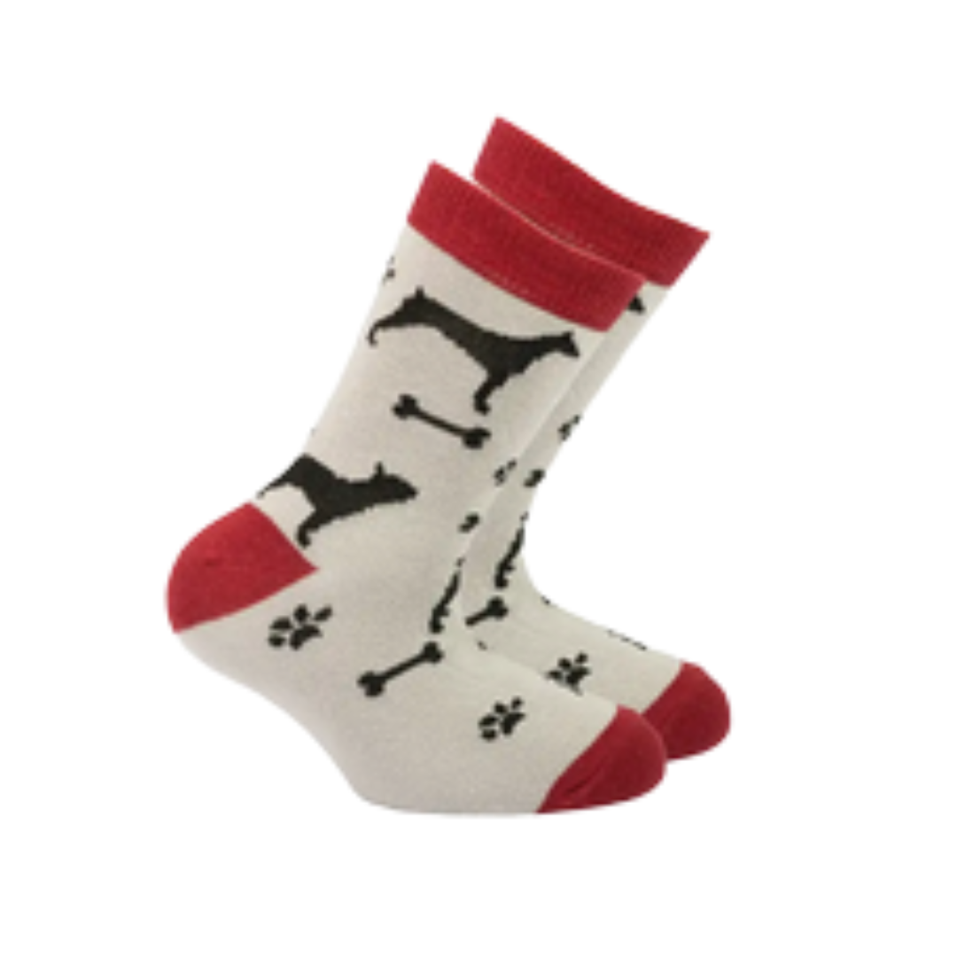 A pair of white crew socks with red cuffs, heels, and toes, featuring a black knit pattern of dog silhouettes, bones, and paw prints.