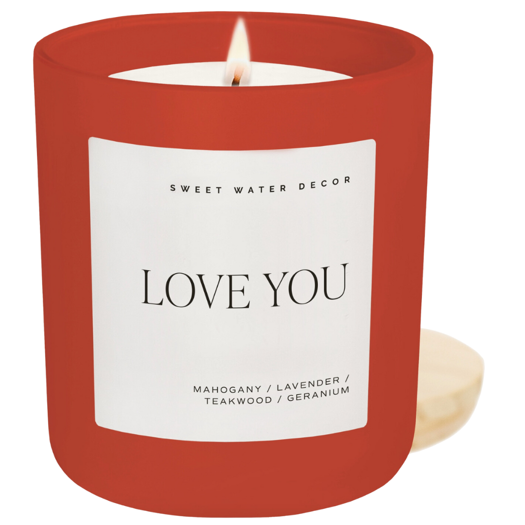 LOVE YOU Soy Candle with a Driftwood and Mahogany scent, featuring lavender and geranium notes. A 15oz candle with a wood lid, 70+ hours of burn time, vegan and non-toxic.