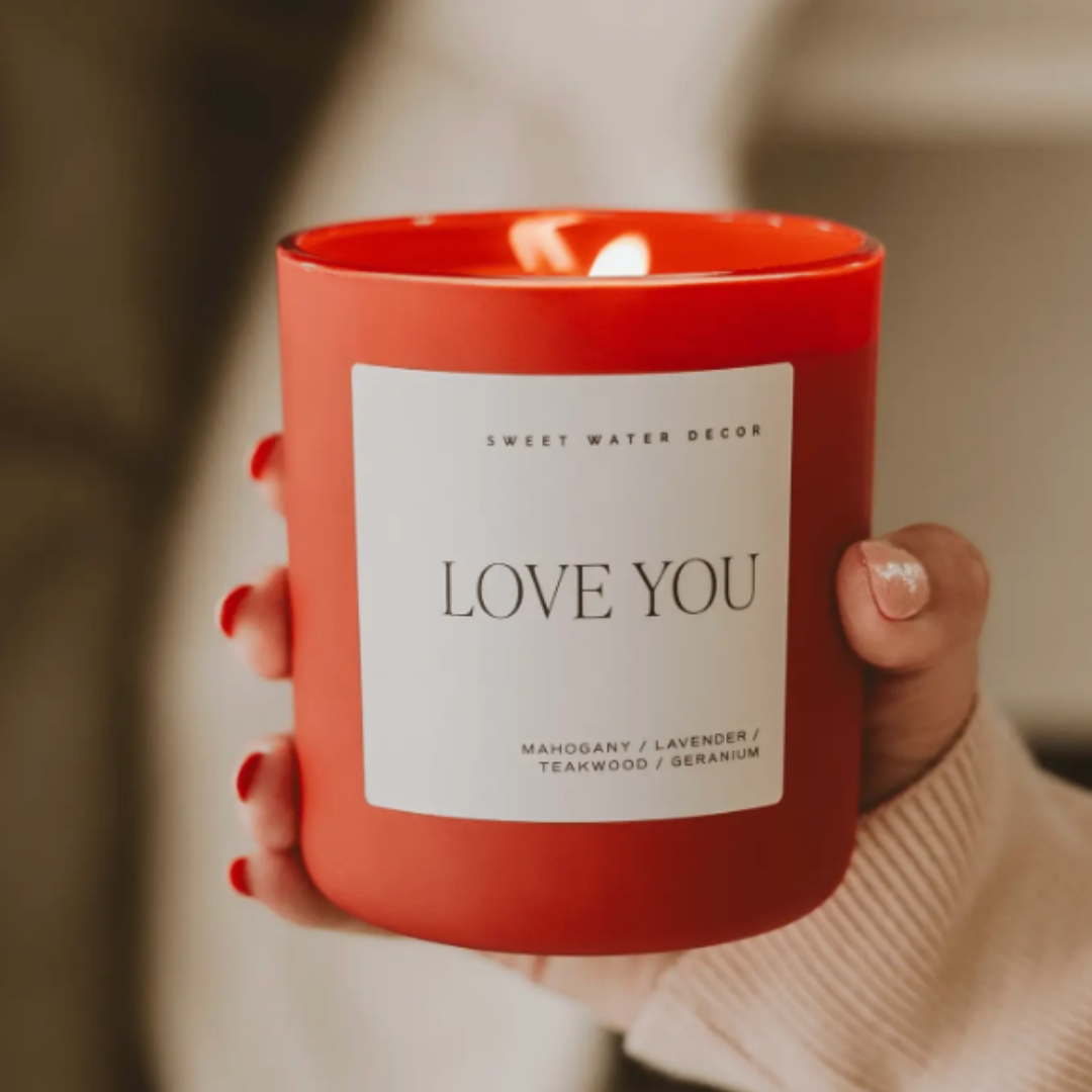 LOVE YOU Soy Candle with a soothing lavender, mahogany, and teakwood scent. 15oz candle with 70+ hours of burn time, made from vegan, non-GMO soy wax.