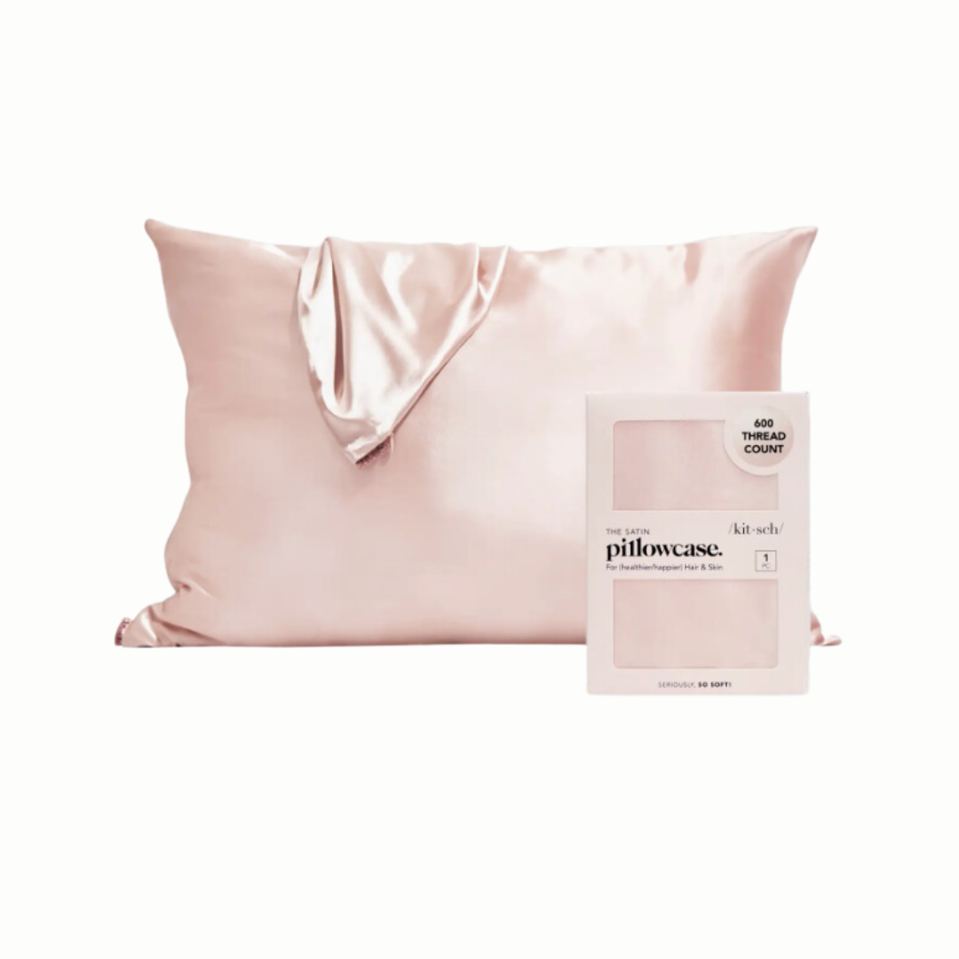 Luxurious blush pink satin pillowcase that helps prevent hair breakage and thinning, ideal for those undergoing chemotherapy. The satin fabric glides over hair and skin, maintaining moisture and reducing friction for a soothing experience.