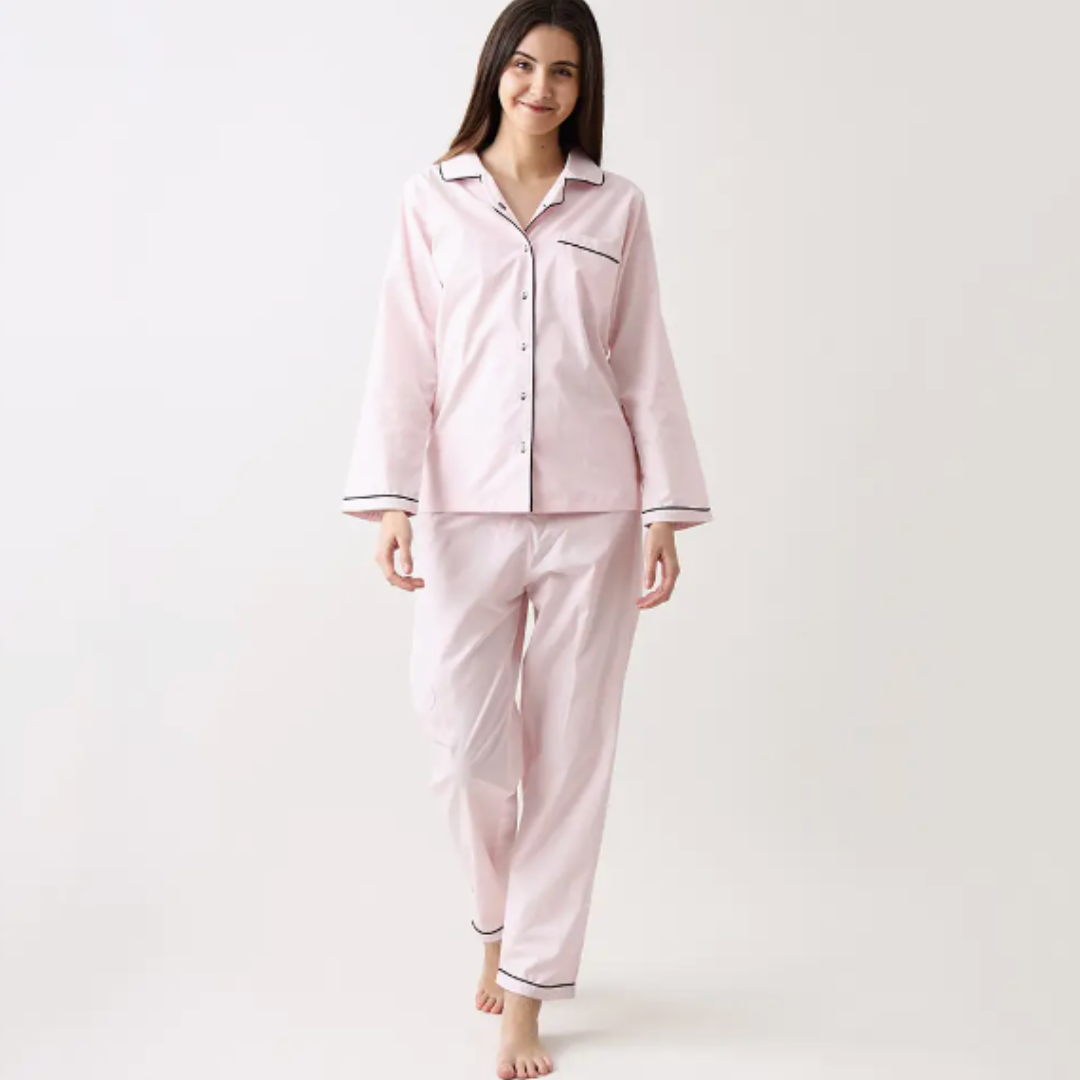 Luxury Classy Pink pajamas by Little West Street, featuring a notched collar top and coordinated pants with front pockets and contrast cording. Packaged in a matching fabric gift bag, this set highlights heirloom-quality craftsmanship and sustainable, waste-reducing practices.