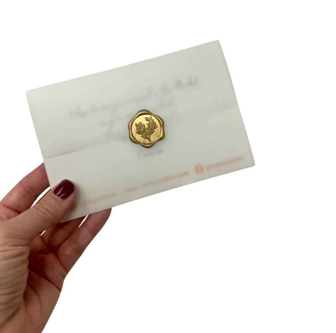 4x6 custom gift card wrapped in vellum and sealed with a gold wax seal.