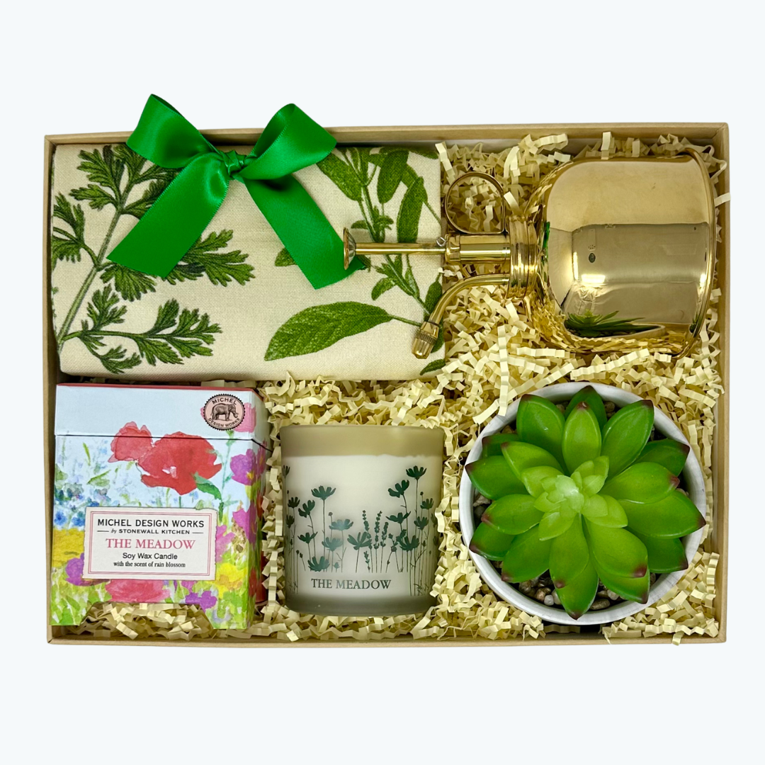 Gift set with candle, plant mister,  tea towel, faux succulent and decorative elements in a box.