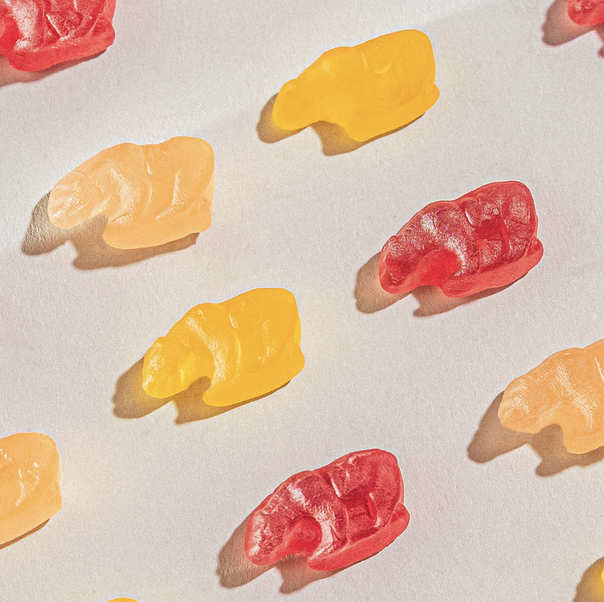 Colorful assortment of 4oz California Mixed Fruit Gummy Bears, featuring a blend of vibrant flavors like cherry, orange, grape, and lemon.