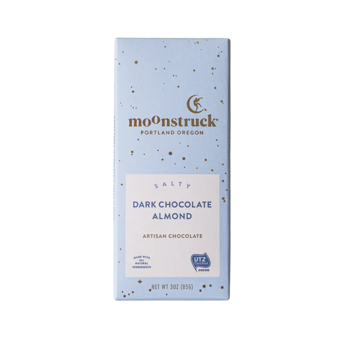 Moonstruck dark chocolate almond bar with light blue packaging on a white background