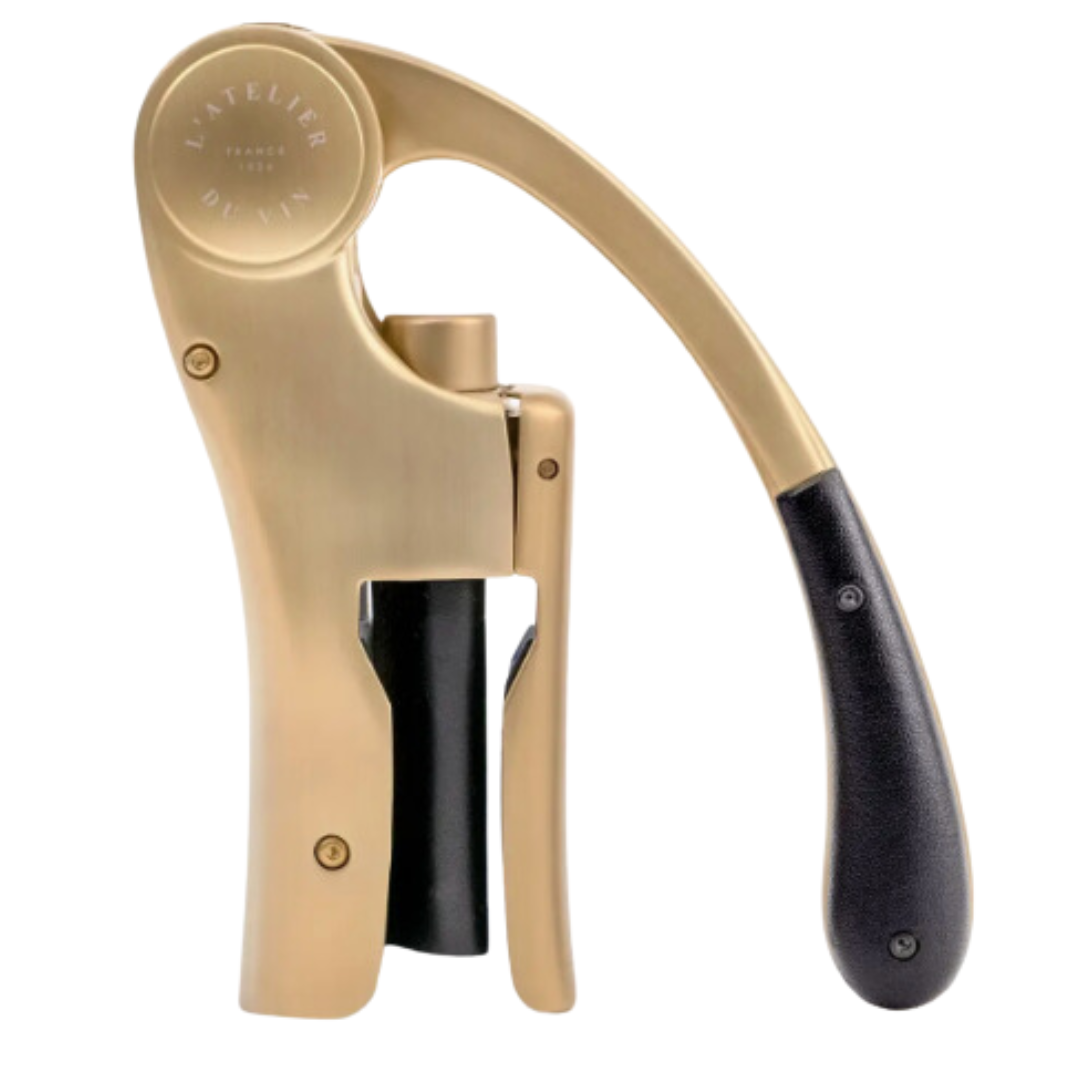 Sleek gold wine opener in motion.