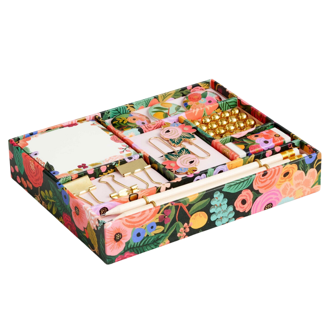 Vibrant floral print box packed with stationery items. Contains a tear-off pad, magnets, paper clips, push pins, eraser, binder clips, and pencils.