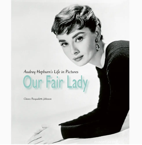 Cover of "Our Fair Lady," a beautifully crafted book celebrating Audrey Hepburn, featuring stunning portraits and iconic images that showcase her extraordinary life and career as a beloved actress and style icon.