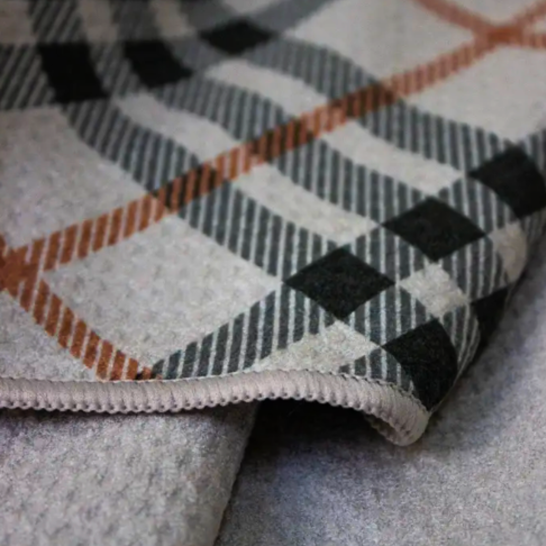 Stylish plaid golf towel designed for optimal moisture absorption and durability on the course.