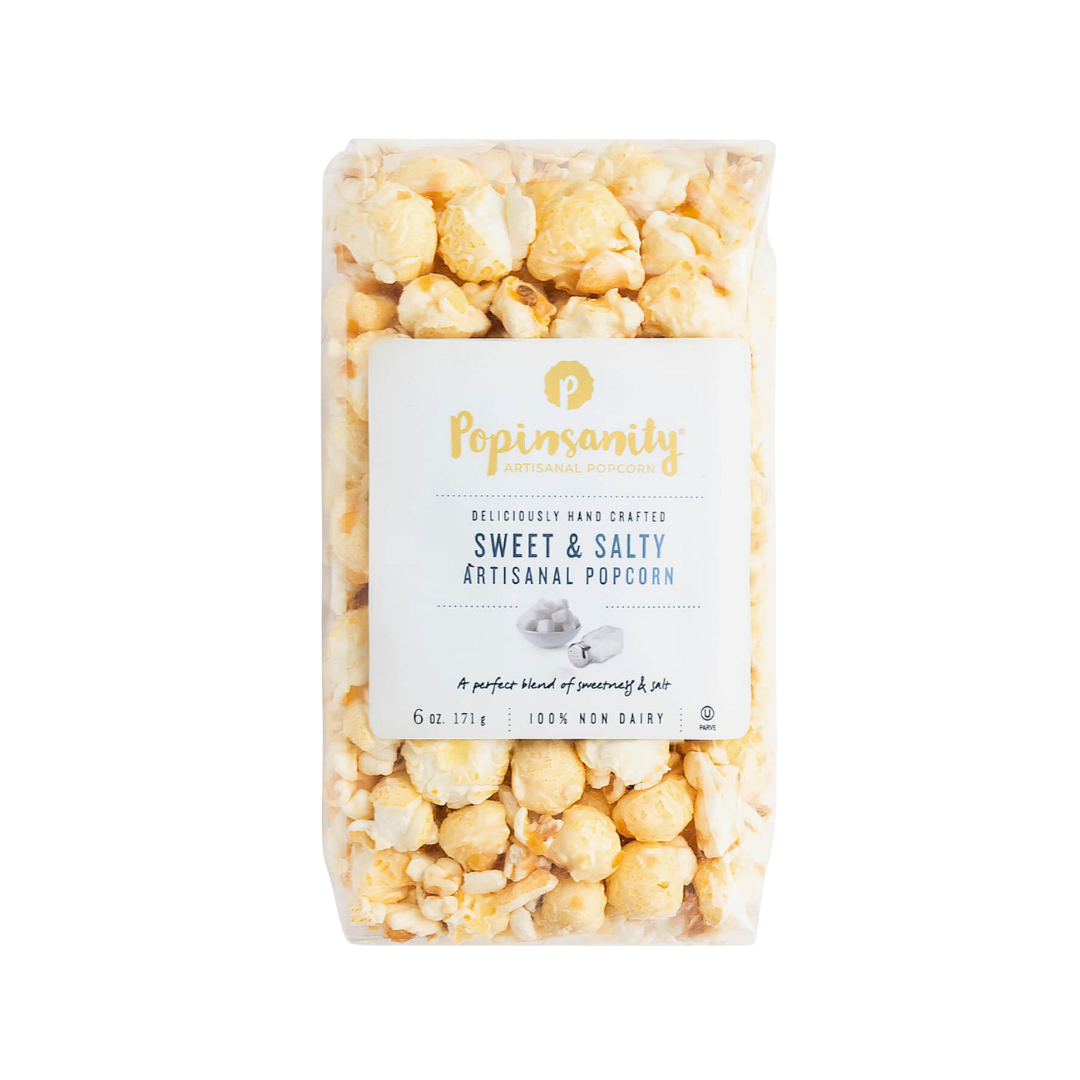 Clear bag of sweet and salty popcorn with a visible brand label on a white background.