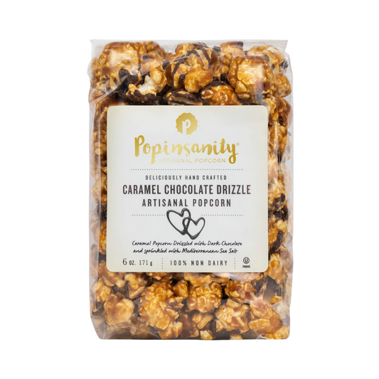 A 6-ounce bag of Caramel Chocolate Drizzle Fancy Popcorn, featuring a rich caramel coating and generous chocolate drizzle, garnished with Mediterranean sea salt. Highlighted as a bestseller and included in Oprah's Favorite Things of 2018.